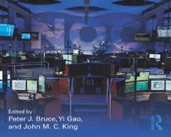 Flight dispatcher in OCC wearing headset monitoring go-around situation with fuel calculations on screen