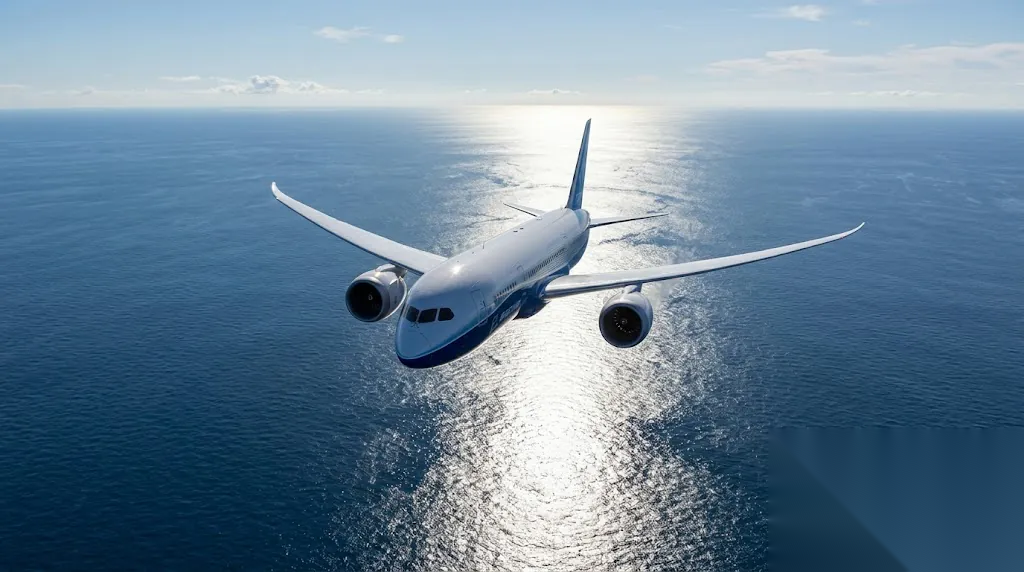 Modern twin-engine Boeing 787 flying over vast open ocean during ETOPS/EDTO oceanic crossing with no land visible